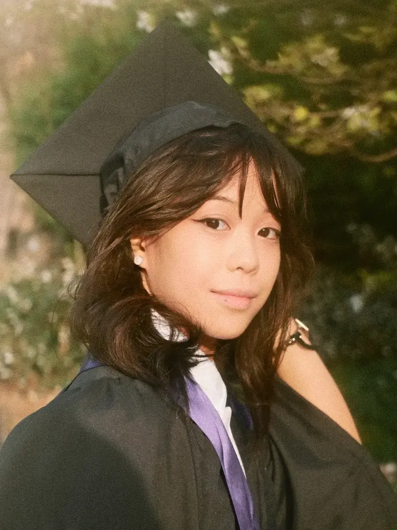UW senior graduation portrait at the Quad cherry blossoms in Seattle