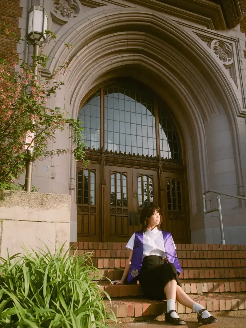 UW graduation portrait at the Quad cherry blossoms in Seattle